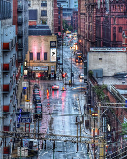 View of city street and buildings during rainy season