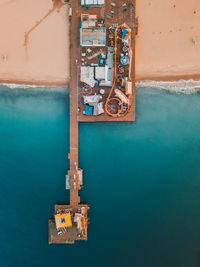 Aerial view of pier by sea