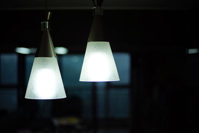Close-up of illuminated lamp hanging at home