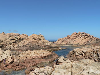 Scenic view of mountains against clear blue sky