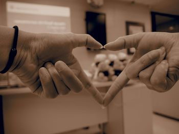 Close-up of man holding hands