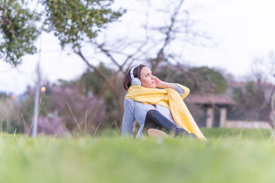 Woman sitting on field