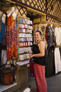 Rear view of woman standing in store