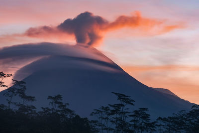 Low angle view of silhouette mountain against sky during sunset