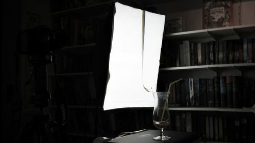 Close-up of open book hanging in room