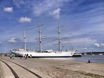 Huge ship moored on lake against sky