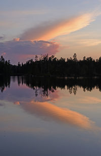 Scenic view of lake against romantic sky at sunset