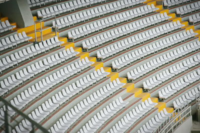 High angle view of empty chairs in stadium