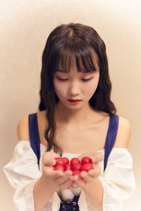 Midsection of woman holding ice cream