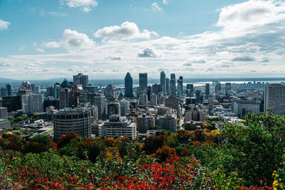 High angle view of modern buildings in city against sky