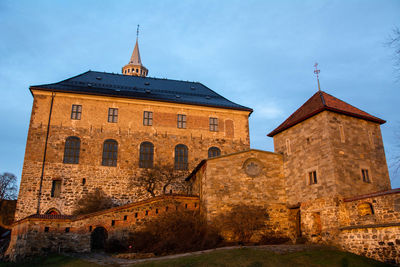 Low angle view of old building against sky