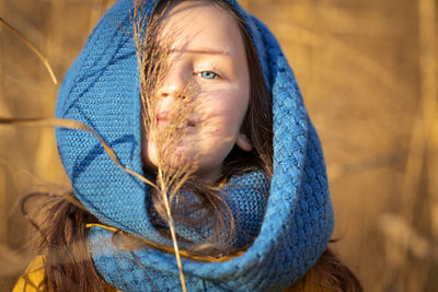 Portrait of cute girl with blue scarf 