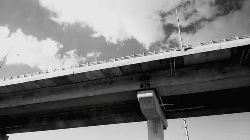 Low angle view of elevated road against sky