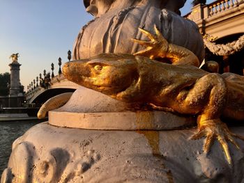 Statue of buddha against building