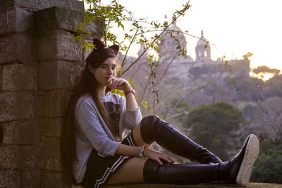 Portrait of woman sitting outdoors