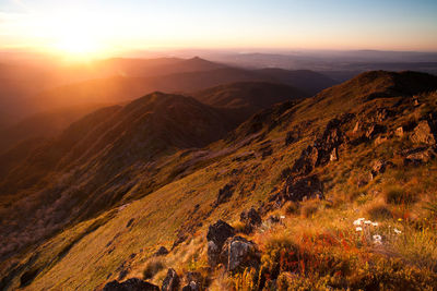 Scenic view of mountains against sky during sunset