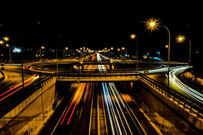 High angle view of light trails in city at night