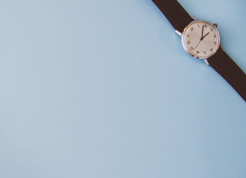 Low angle view of clock against white background