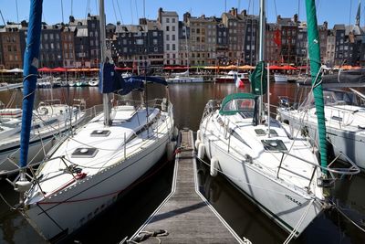 Boats moored at harbor