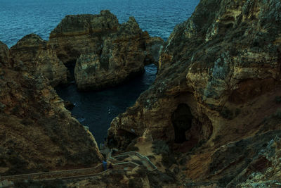 High angle view of rocks in sea