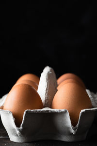 Close-up of cake against black background