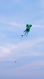 Low angle view of kite flying against sky