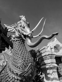 Low angle view of statue against sky