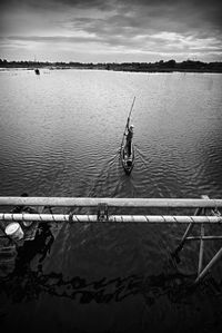 High angle view of man sailing boat in lake