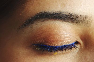 Extreme close-up of woman with eyeliner