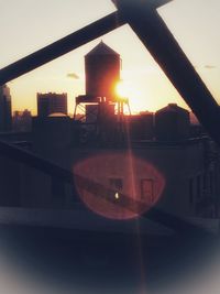 Close-up of buildings against sky during sunset