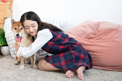 Full length of woman with dog