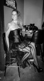 Portrait of woman sitting on chair