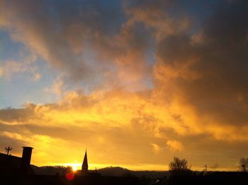 Scenic view of dramatic sky during sunset