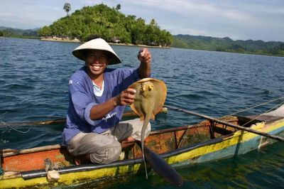Portrait of a young woman sitting on bench