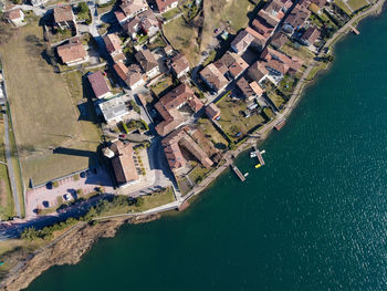 Aerial view of the village of san felice al lago on endine lake.	