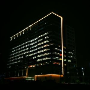 Low angle view of building against sky at night