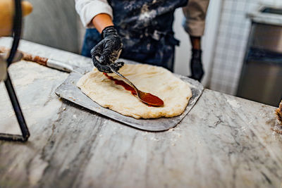 Baking and serving pitta brad, pizza and fresh bread in dinner restaurant and social events.