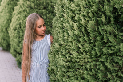 Candid caucasian happy little kid girl of eight years old with long blond hair