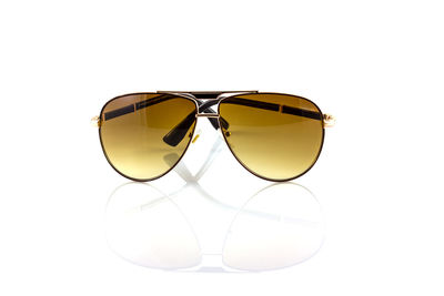 Close-up of sunglasses against white background