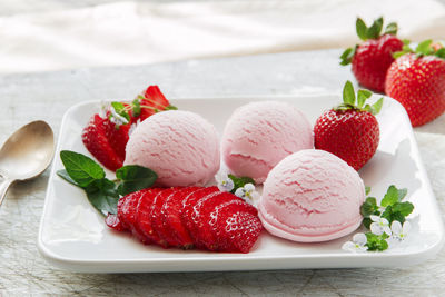 Close-up of strawberries and fruits in plate