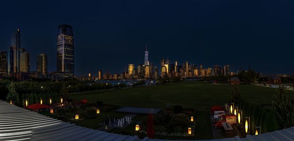 Illuminated buildings in city at night