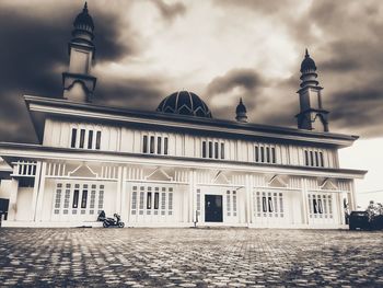 View of historical building against cloudy sky