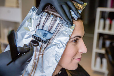 Close-up portrait of woman wearing mask at store