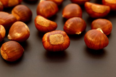 Close-up of hazelnuts against black background