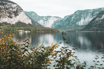 Scenic view of lake and mountains against sky