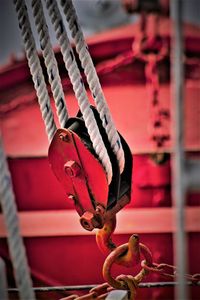 Close-up of rusty tied to metal