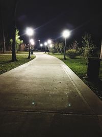 Illuminated street lights at night