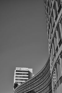 Low angle view of skyscrapers against clear sky