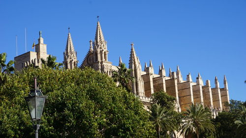 Low angle view of temple against blue sky