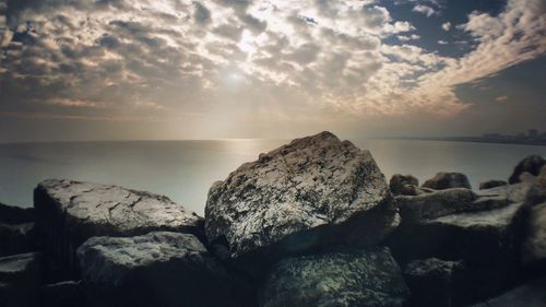 Scenic view of sea against cloudy sky